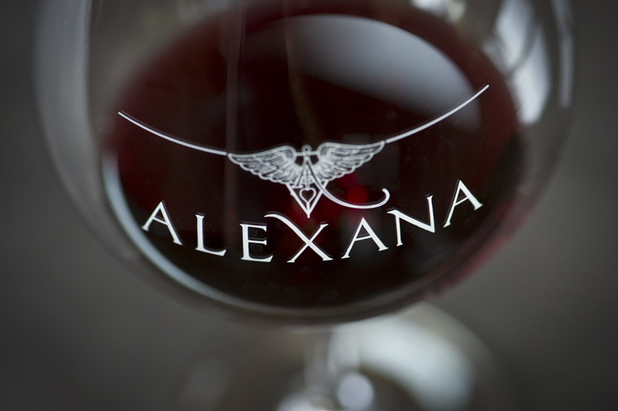 Find creative ways to showcase your logo, as seen in a glass of pinot noir